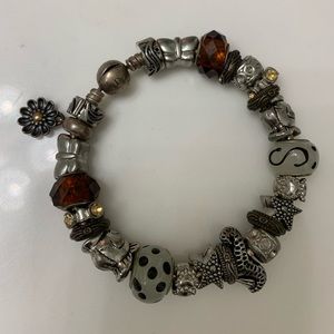 Beautiful charm bracelet with one Pandora …